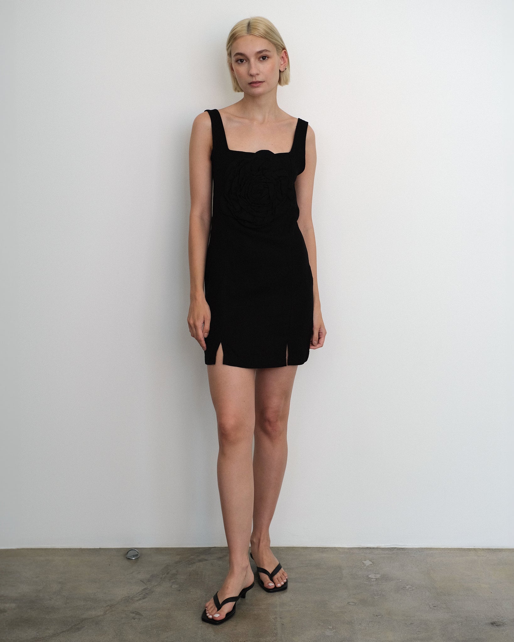 Model wearing the Marina Dress in black linen from Tach