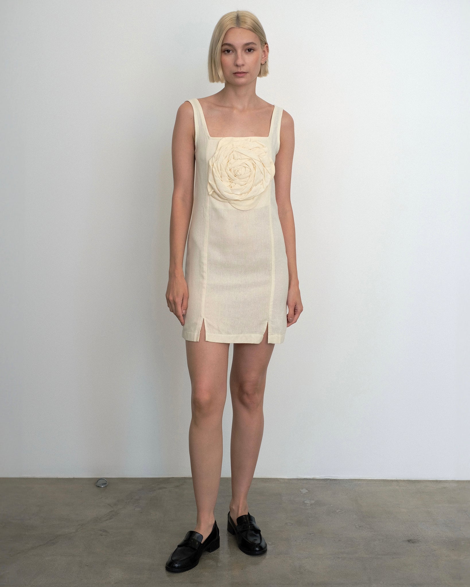 Model wearing the Marina Dress in ivory linen from Tach