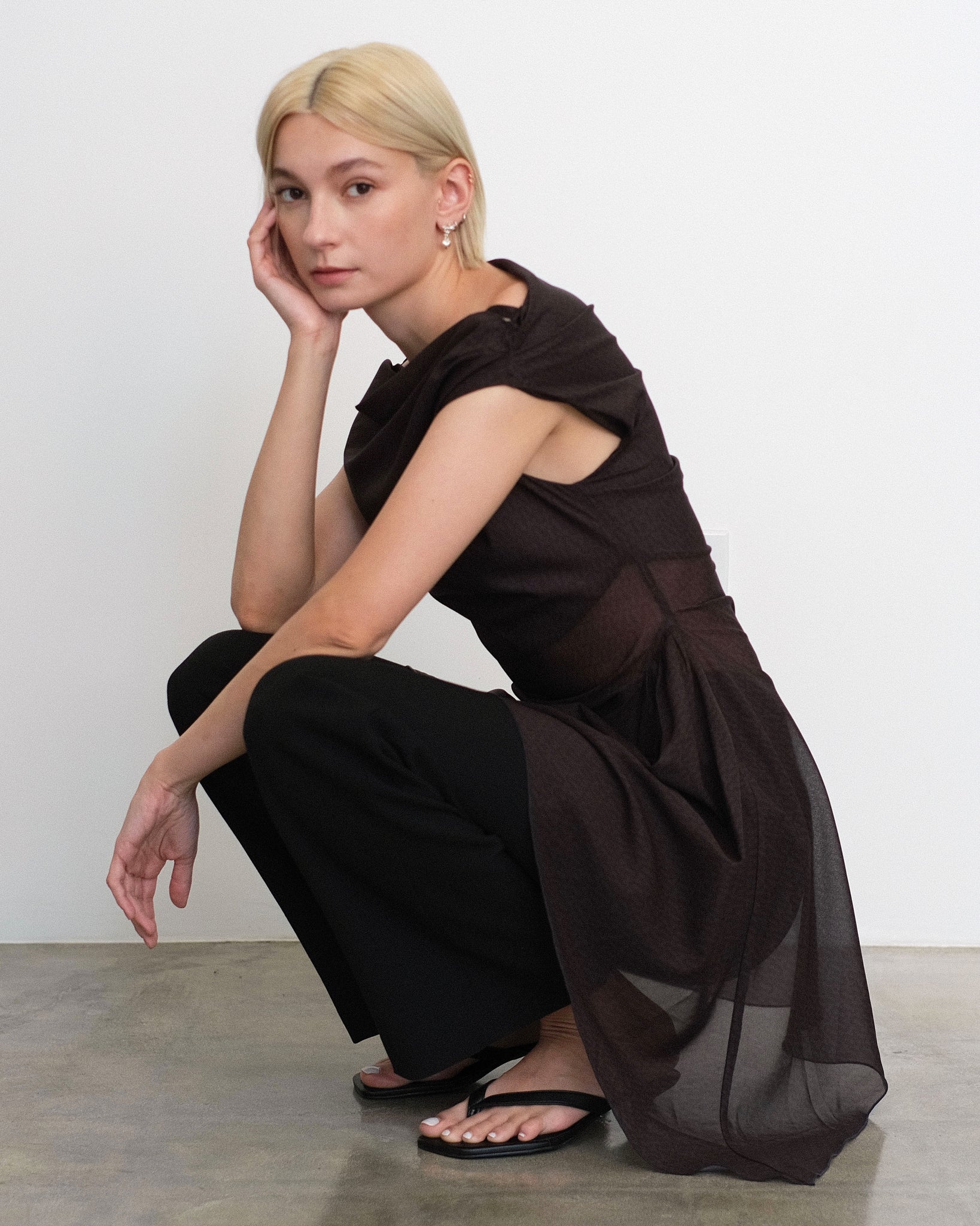 Model wearing Awen dress in sheer brown and black print from Una Hayde