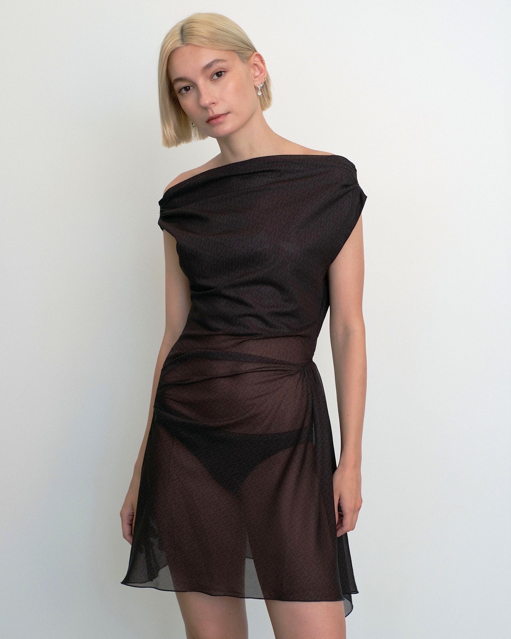 Model wearing Awen dress in sheer brown and black print from Una Hayde