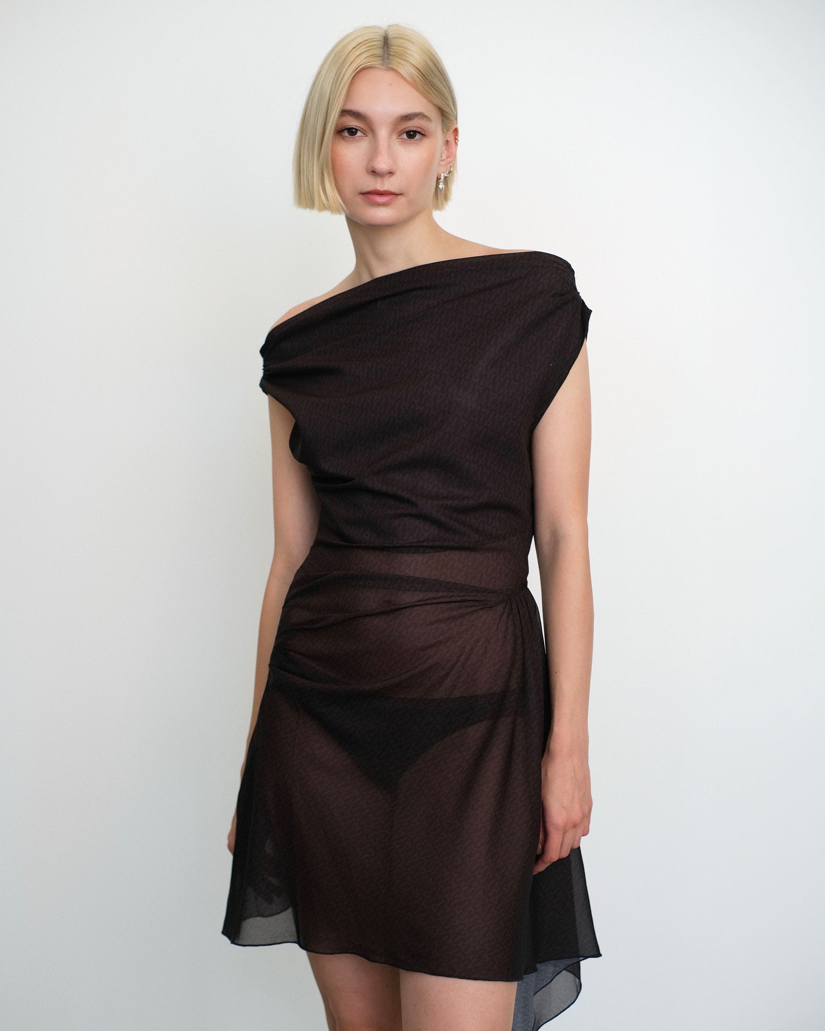 Model wearing Awen dress in sheer brown and black print from Una Hayde