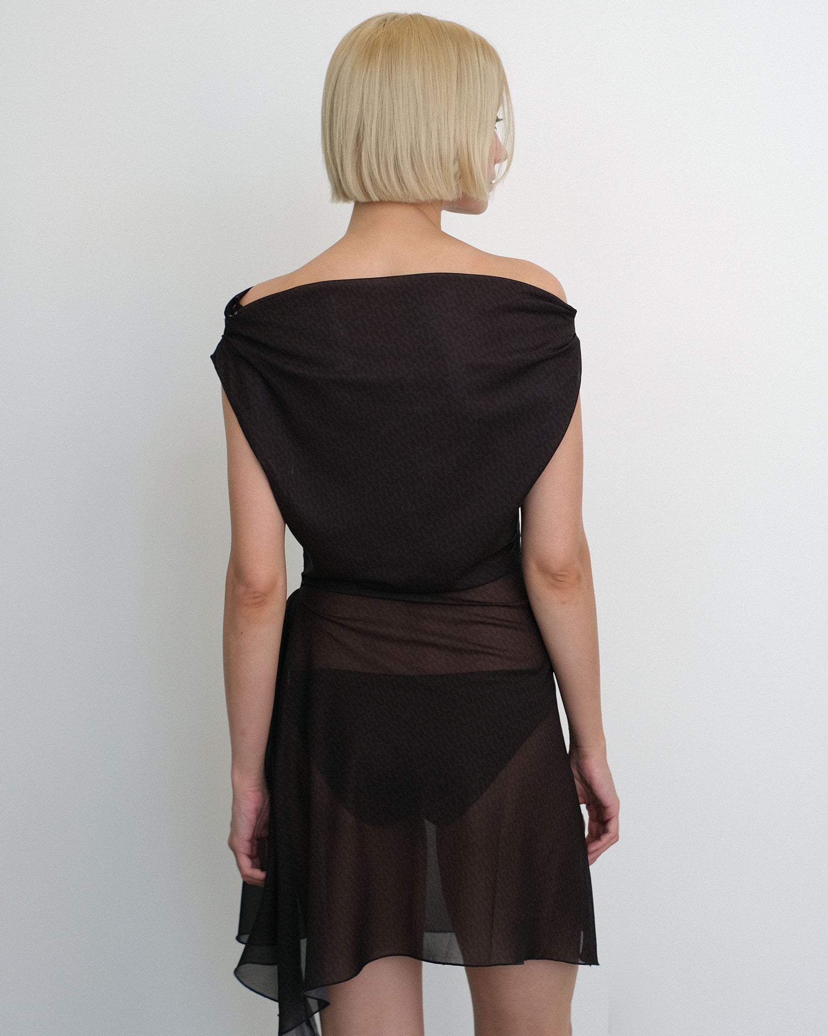 Model wearing Awen dress in sheer brown and black print from Una Hayde
