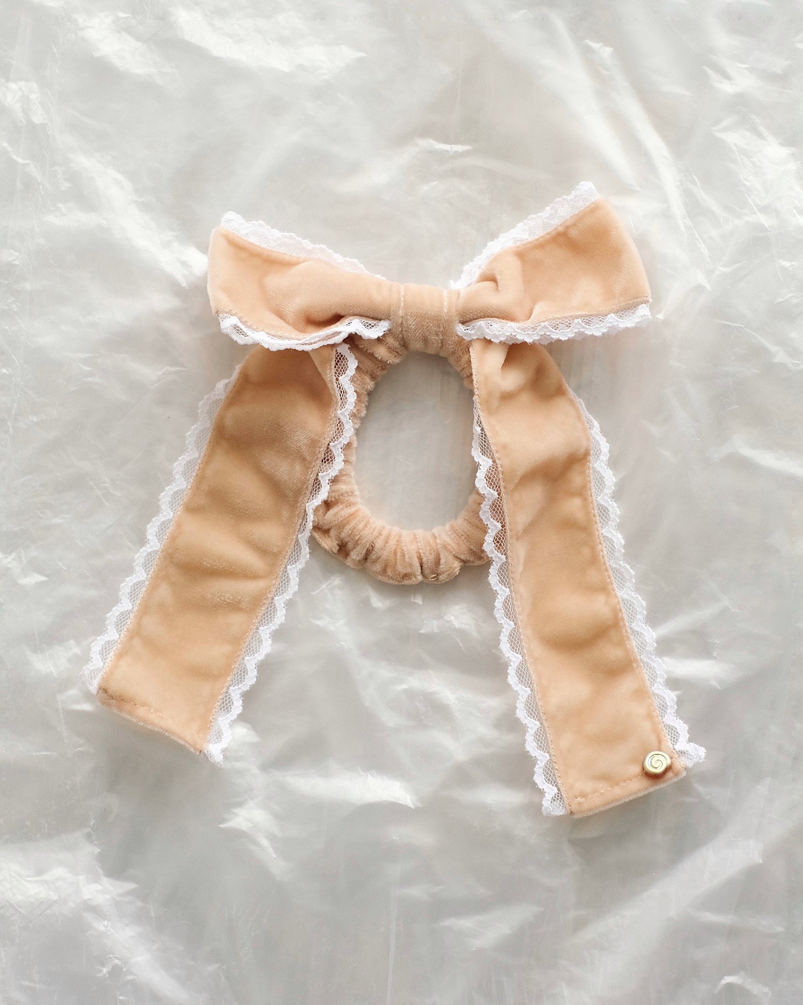 Merrma velvet bow scrunchie with lace trim in sand and white